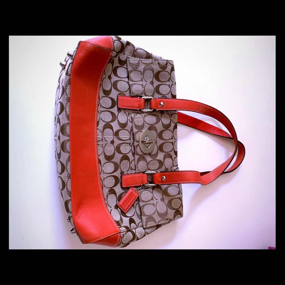 Orangish red and brown over the shoulder coach bag